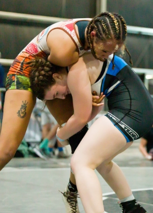 Wrestlers competing on the mat